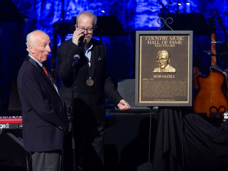 Bob McDill reacts to the unveiling of his hall of fame plaque during the 2023 Country Music Hall of Fame induction ceremony Sunday, October 22, 2023.