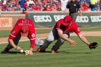 Oct 4, 2015; Arlington, TX, USA; Los Angeles Angels third baseman David Freese (6) and relief pitcher Cam Bedrosian (68) collide while chasing a bunt hit by Texas Rangers center fielder Delino DeShields (not pictured) during the seventh inning at Globe Life Park in Arlington. The Rangers won 9-2 and clinch the American League West division. Mandatory Credit: Jerome Miron-USA TODAY Sports