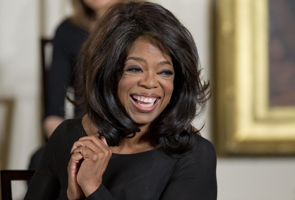 FILE - In this Nov. 20, 2013, file photo, Oprah Winfrey smiles before being awarded the Presidential Medal of Freedom by President Barack Obama in the East Room of the White House in Washington. If Donald Sterling is compelled to sell the Los Angeles Clippers, the list of potential buyers will have more stars than the team's roster. Winfrey leads the list of wealthy luminaries who announced their interest in purchasing the club shortly after NBA Commissioner Adam Silver banned Sterling from the league for life. (AP Photo/ Evan Vucci, File)