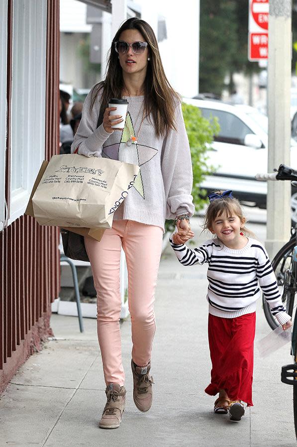 Pictured: Alessandra Ambrosio wearing Ash wedge sneakers.