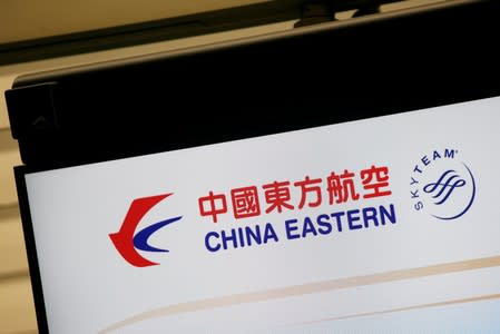 FILE PHOTO: The logo of China Eastern Airlines is shown on a panel at a check-in counter at Hong Kong Airport in Hong Kong