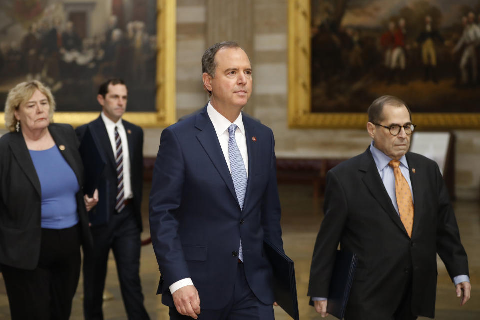 Impeachment managers, House Judiciary Committee Chairman, Rep. Jerrold Nadler, D-N.Y., right, and House Intelligence Committee Chairman Adam Schiff, D-Calif., center, lead as D-Fla., Rep. Zoe Lofgren, D-Calif., and Rep. Jason Crow, D-Colo., follow as they walk through the rotunda on their way to the Senate on Capitol Hill in Washington, Thursday, Jan. 16, 2020. (AP Photo/Julio Cortez)