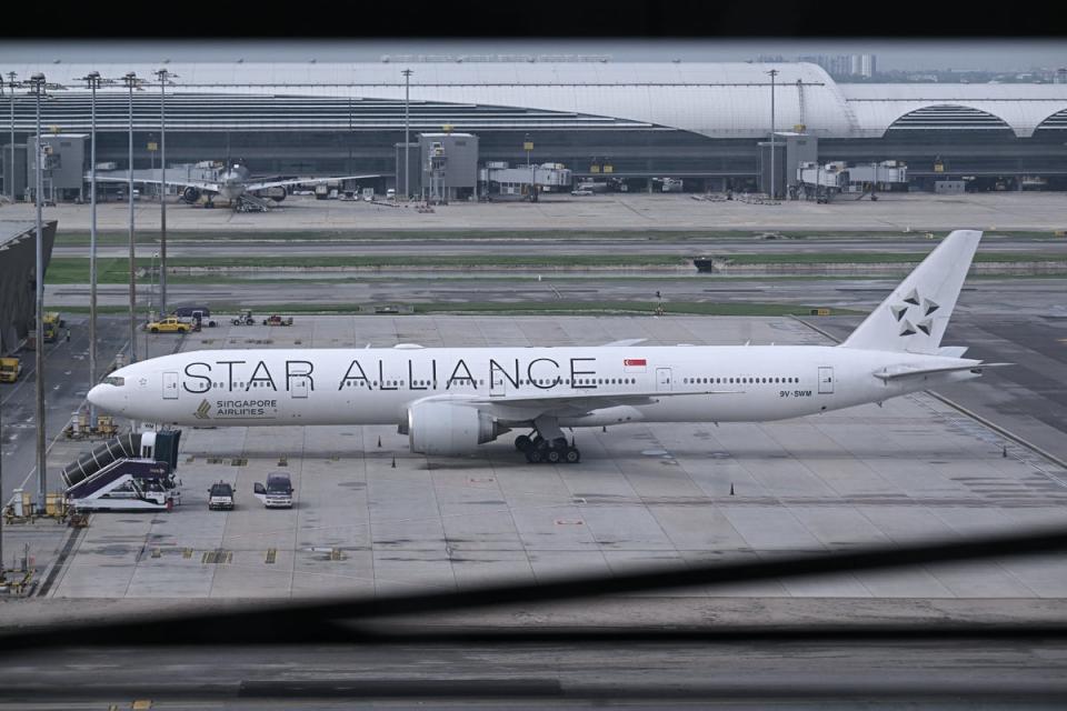 Singapore Airlines flight SQ321, which was headed to Singapore from London before making an emergency landing in Bangkok due to severe turbulence, is seen on the tarmac at the Suvarnabhumi International Airport in Bangkok on 22 May 2024 (AFP via Getty Images)
