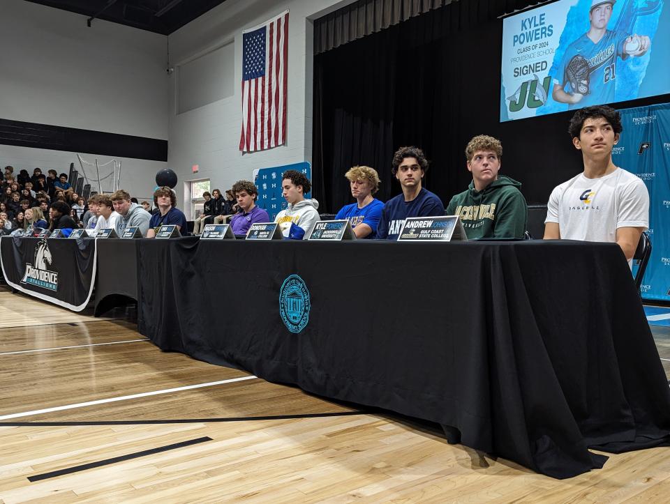 Members of Providence's 2024 signing class prepare to sign letters of intent on National Signing Day.