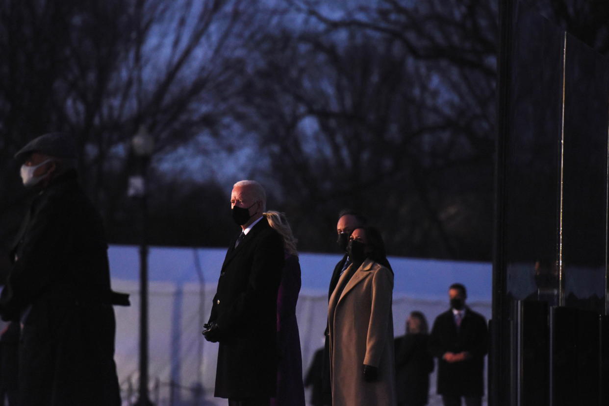 Joe Biden pauses at a memorial to honor those who died from complications due to the coronavirus at the Lincoln Memorial in Washington, D.C., Jan. 19. (Callaghan O'Hare/Reuters)