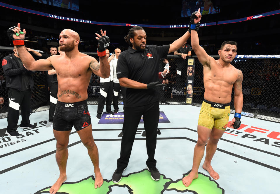 Rafael Dos Anjos (R) celebrates his victory over Robbie Lawler in their welterweight bout during the UFC Fight Night event at Bell MTS Place on December 16, 2017 in Winnipeg, Manitoba, Canada. (Getty Images)