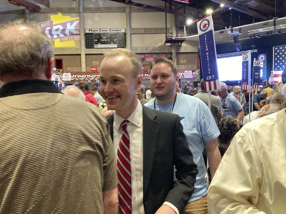 Republican attorney general candidate Jim Schultz greets delegates at the Minnesota Republican State Convention in Rochester, Minn., on Friday, May 13, 2022. Schultz, a hedge fund lawyer, is challenging Democratic Attorney General Keith Ellison. (AP Photo/Steve Karnowski)