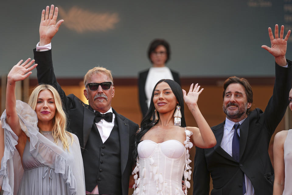 Sienna Miller, from left, Kevin Costner, Wase Chief, and Luke Wilson pose for photographers upon arrival at the premiere of the film 'Horizon: An American Saga' at the 77th international film festival, Cannes, southern France, Sunday, May 19, 2024. (Photo by Daniel Cole/Invision/AP)