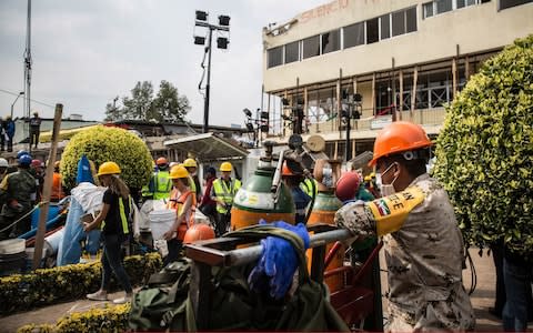 At least 25 bodies have been pulled from the wreckage at Enrique Rebsamen school following the magnitude 7.1 quake - Credit: Daniel Cardenas/Anadolu Agency