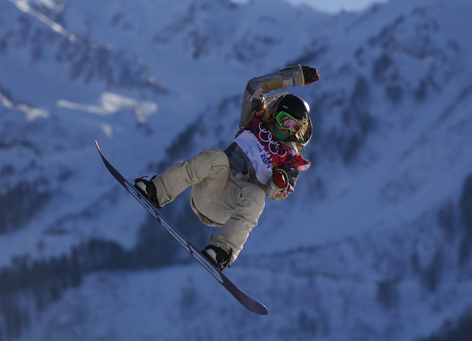 United States' Jamie Anderson takes a jump during the women's snowboard slopestyle qualifying at the Rosa Khutor Extreme Park ahead of the 2014 Winter Olympics, Thursday, Feb. 6, 2014, in Krasnaya Polyana, Russia. (AP Photo/Sergei Grits)