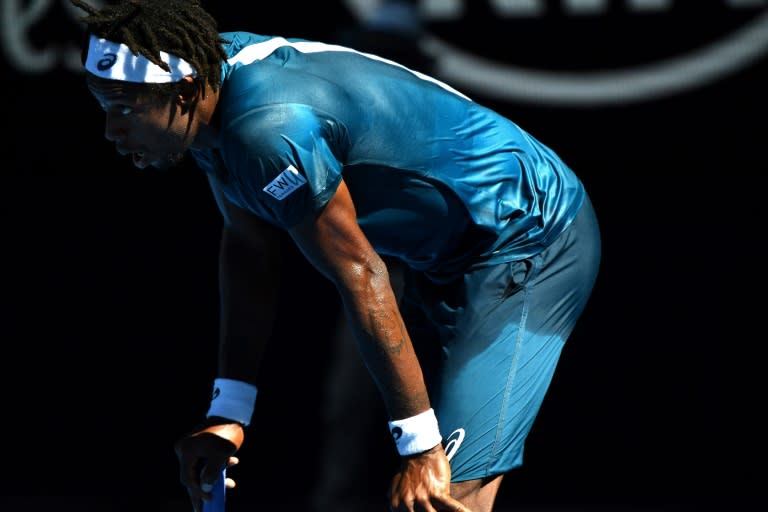 France's Gael Monfils catches his breath during his second round singles match against Serbia's Novak Djokovic on day four of the Australian Open in Melbourne on January 18, 2018