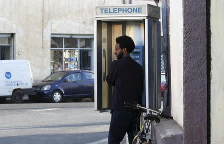 A man uses a public telephone in Eritrea's capital Asmara, February 20, 2016. REUTERS/Thomas Mukoya