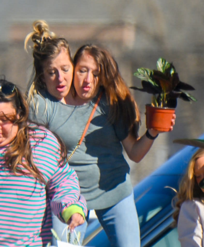 Abby and Brittany pick up a potted plant following a lunch date. MEGA