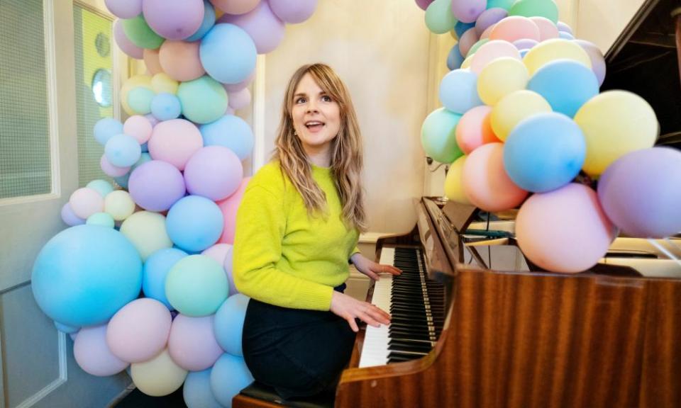 Elle Hunt trying out the piano at the Assembly House, Norwich.