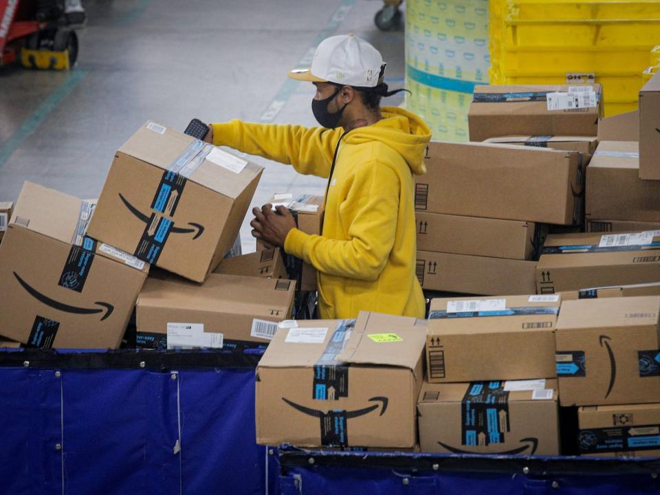 Amazon employee scanning packages