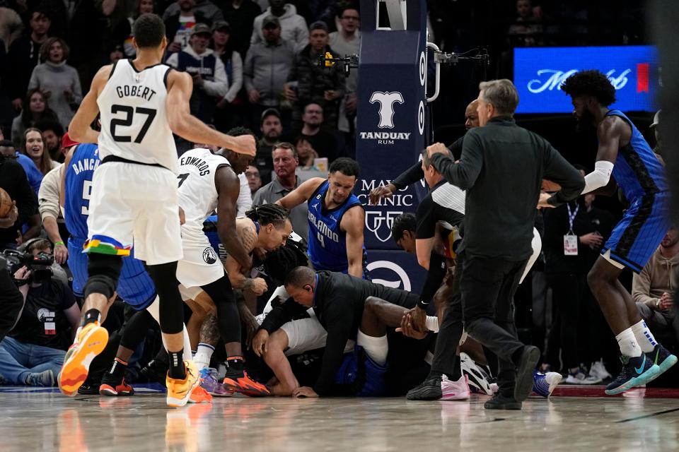 A scrum breaks out between Minnesota Timberwolves and Orlando Magic.