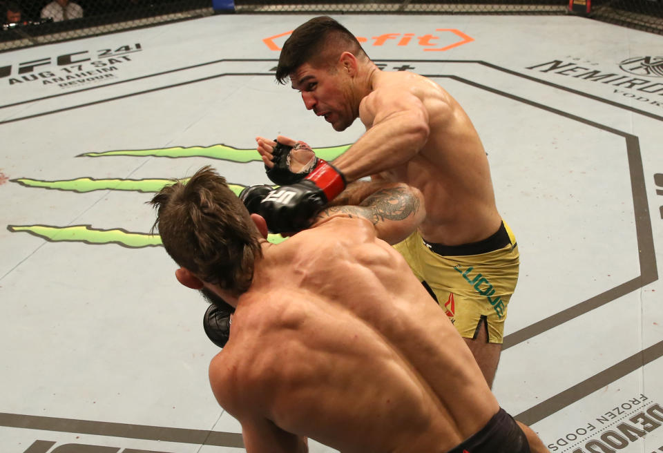 MONTEVIDEO, URUGUAY - AUGUST 10:  (R-L) Vicente Luque punches Mike Perry in their welterweight fight during the UFC Fight Night event at Antel Arena on August 10, 2019 in Montevideo, Uruguay. (Photo by Alexandre Schneider /Zuffa LLC/Zuffa LLC)