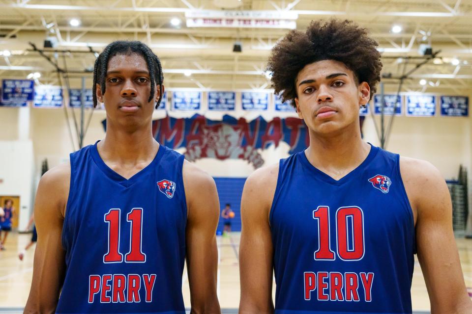 Perry's Cody Williams (left) and Koa Peat (right) pose for a photo at basketball practice in the school's gym on Nov. 7, 2022, in Gilbert, Ariz.
