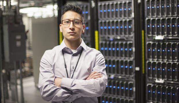 Proud young server room technician