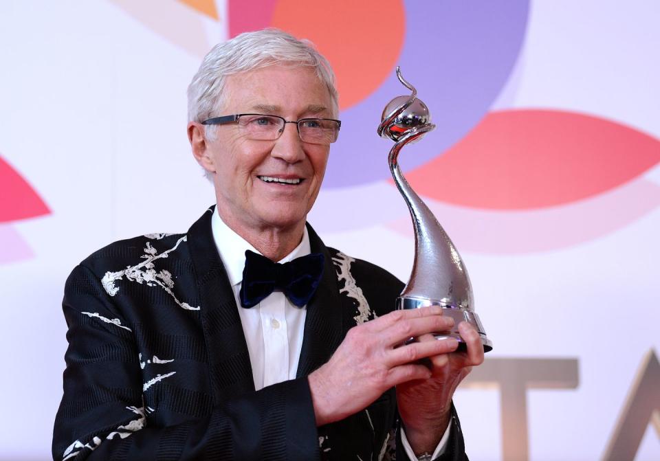 paul o'grady smiles as he holds his ntas trophy at the 2019 ceremony