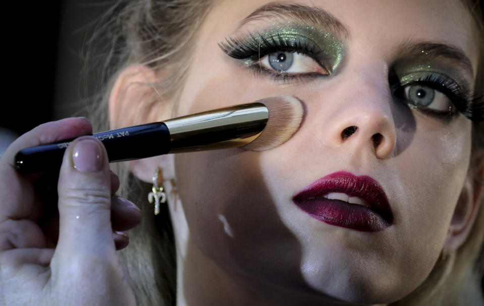 A model is styled backstage before appearing in the Anna Sui fashion show during New York's Fashion Week, Monday Feb. 10, 2020. (AP Photo/Bebeto Matthews)