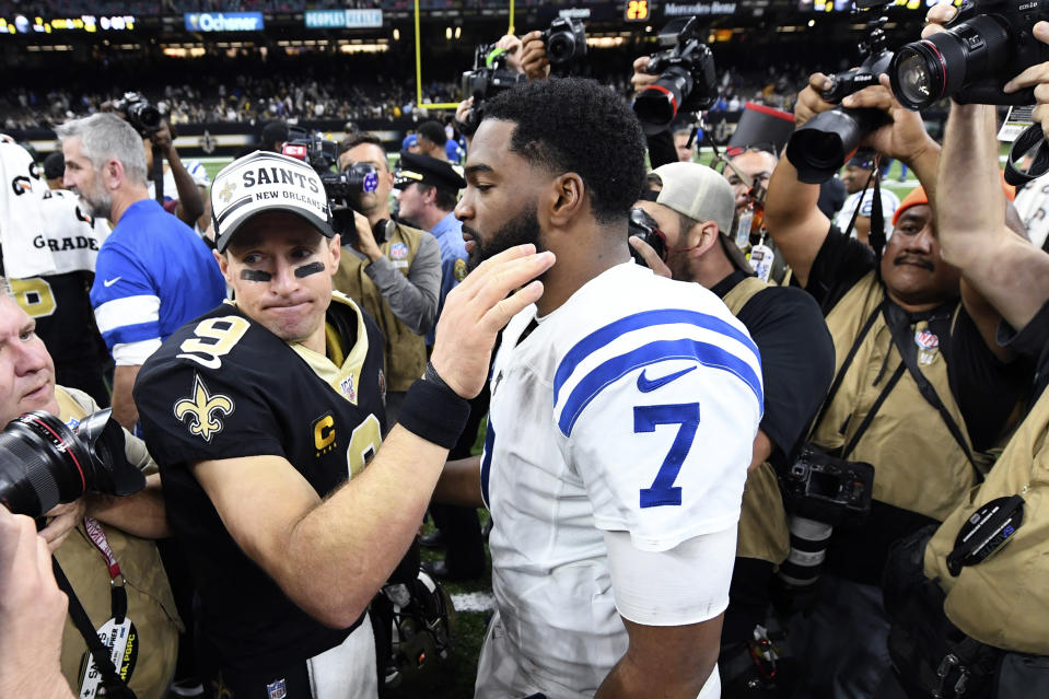 New Orleans Saints quarterback Drew Brees (9) greets Indianapolis Colts quarterback Jacoby Brissett (7) after an NFL football game in New Orleans, Monday, Dec. 16, 2019. The Siant won 34-7. (AP Photo/Bill Feig)