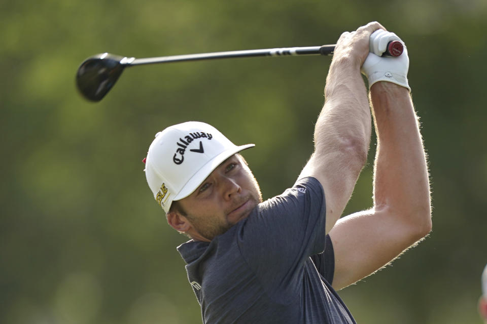 Sam Burns hits a tee shot on the 18th hole during a playoff in the final round of the Charles Schwab Challenge golf tournament at the Colonial Country Club in Fort Worth, Texas, Sunday, May 29, 2022. (AP Photo/LM Otero)