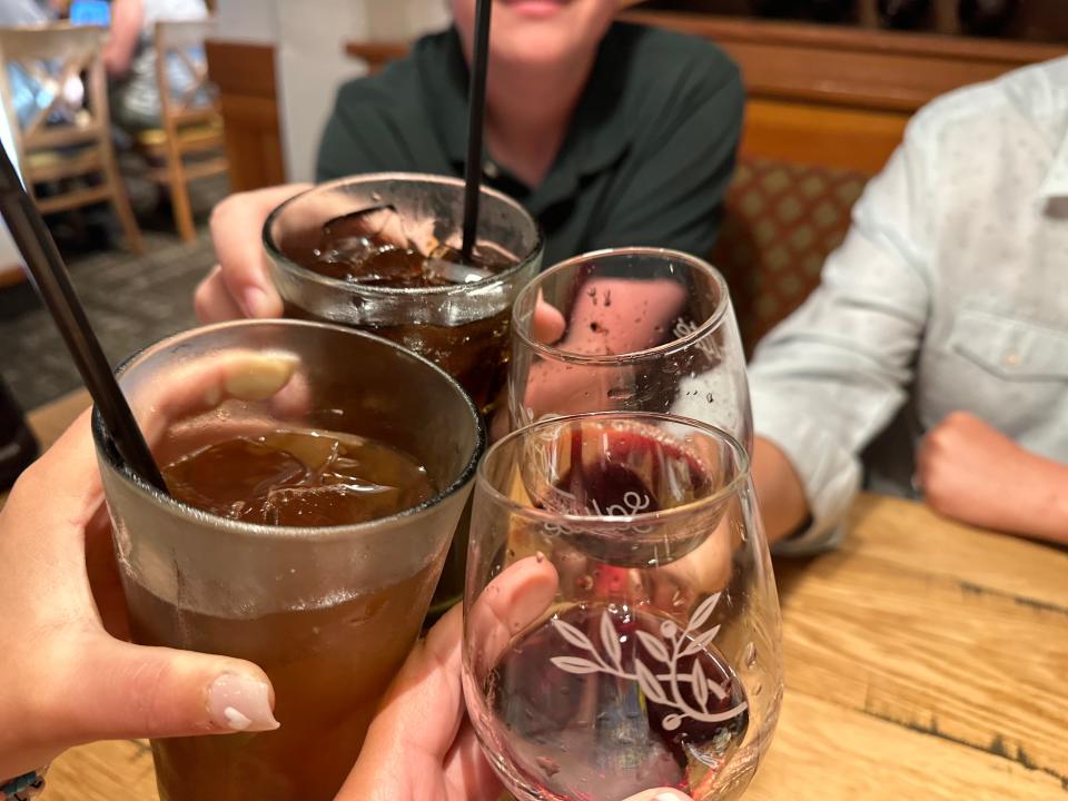 Family cheersing drinks at Olive Garden 