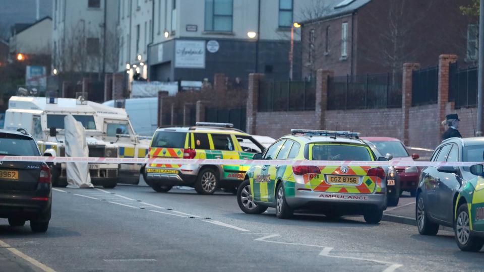 <p>Scores of children looked on as a lone gunman shot dead a man sitting in his car outside a school in west Belfast.</p>