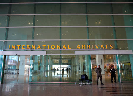 Airport Security Force (ASF) personnel stand guard at the International arrivals area during a media tour of the newly built Islamabad International Airport, ahead of its official opening, Pakistan April 18, 2018. REUTERS/Faisal Mahmood