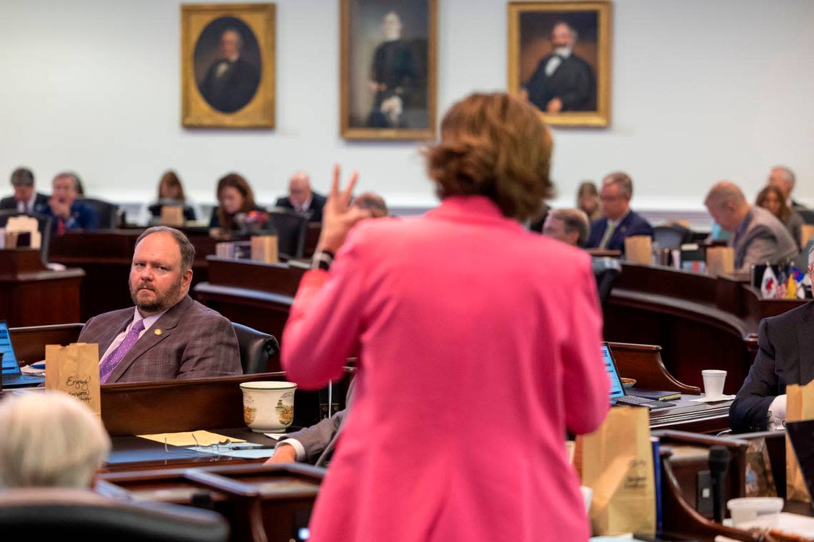 Republican Senator Ralph Hise listens to Democratic Senator Natasha Marcus of Mecklenburg County as she makes an emboldened plea to fellow Senators to save her district during debate of Senate Bill 758, which redraws the North Carolina Senate districts on Tuesday, October 24, 2023 at the General Assembly in Raleigh, N.C.