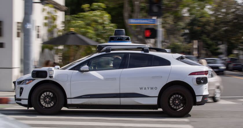 Santa Monica, CA - February 21: Passengers ride in an electric Jaguar I-Pace car outfitted with Waymo full self-driving technology in Santa Monica Tuesday, Feb. 21, 2023. (Allen J. Schaben / Los Angeles Times)