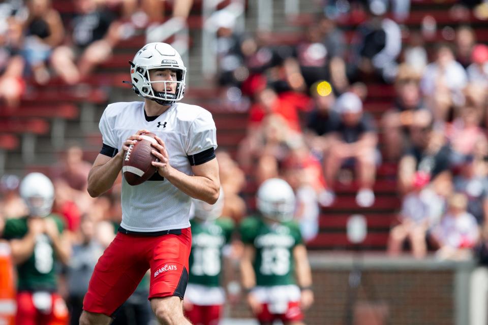 Cincinnati Bearcats quarterback Brady Drogosh (12) hesitates before passing the ball during the Cincinnati Bearcats spring scrimmage at Nippert Stadium on Saturday, April 15, 2023.