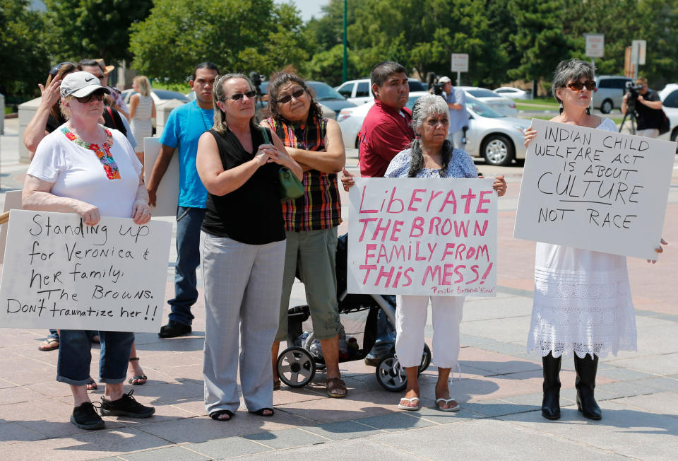 Participants listen during a rally in support of the Indian Child Welfare Act, in Oklahoma City, on Aug. 19, 2013, after the Supreme Court’s decision in <em>Adoptive Couple v. Baby Girl</em>.<span class="copyright">Sue Ogrocki—AP</span>