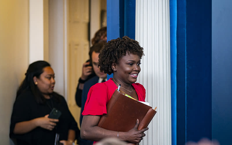 White House Press Secretary Karine Jean-Pierre smiles as she arrives for her first press conference