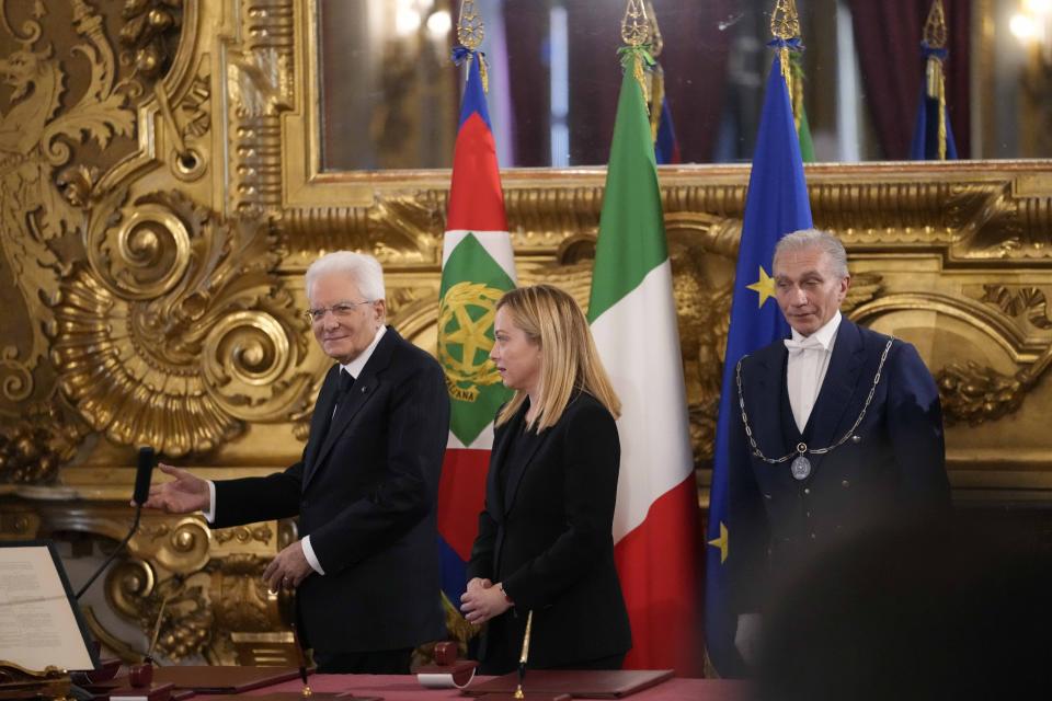 Italian President Sergio Mattarella gestures to the newly appointed Italian Premier Giorgia Meloni after the swearing in ceremony of Italy's first far-right-led government since the end of World War II at Quirinal presidential palace in Rome, Saturday, Oct. 22, 2022. (AP Photo/Alessandra Tarantino)