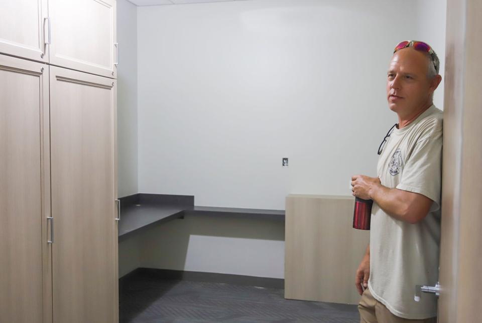 Florosa Fire Chief Mark Lee stands in the doorway of one of nine firefighters' bunk rooms as construction continues on the new fire station on U.S. Highway 98.