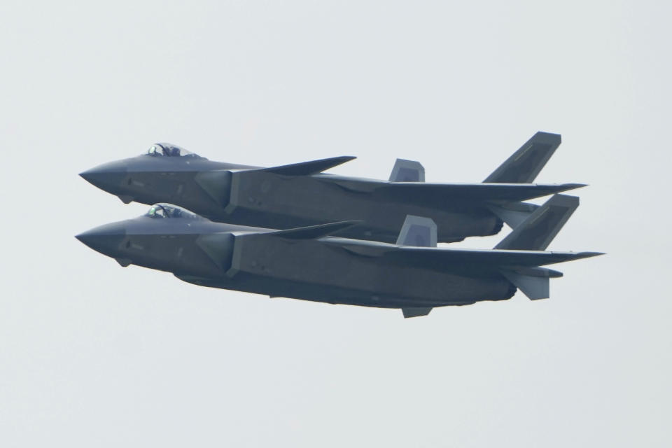 A pair of J-20 stealth fighter jets of the Chinese People's Liberation Army (PLA) Air Force perform during the 13th China International Aviation and Aerospace Exhibition, also known as Airshow China 2021, on Tuesday, Sept. 28, 2021 in Zhuhai in southern China's Guangdong province. (AP Photo/Ng Han Guan)