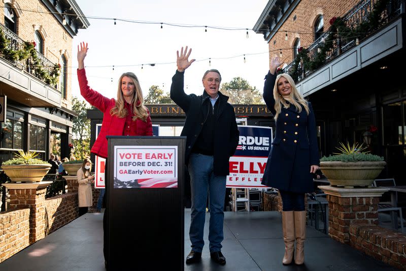 FILE PHOTO: Senator Kelly Loeffler (R-GA), Senator David Perdue (R-GA), and White House senior advisor Ivanka Trump wave during a campaign event in Milton