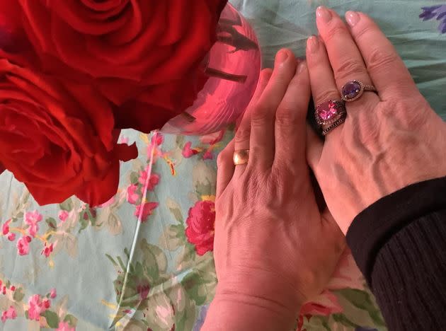 The author and her husband's hands, wearing their new wedding rings, on their wedding day. (Photo: Courtesy of Susan Corso)