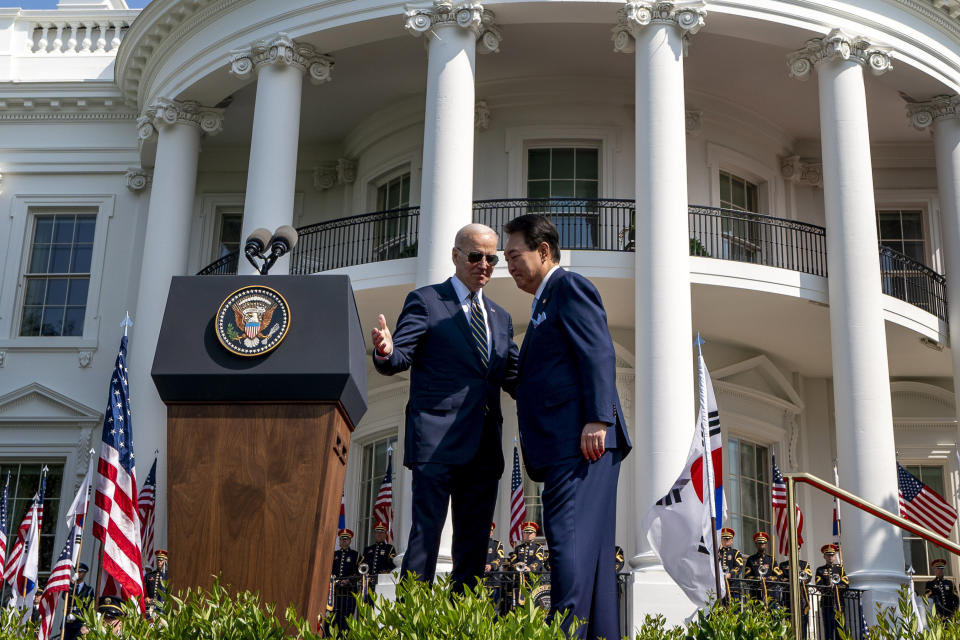 President Joe Biden and South Korea's President Yoon Suk Yeol stand on stage during a State Arrival Ceremony on the South Lawn of the White House in Washington, Washington, Wednesday, April 26, 2023. (AP Photo/Andrew Harnik)