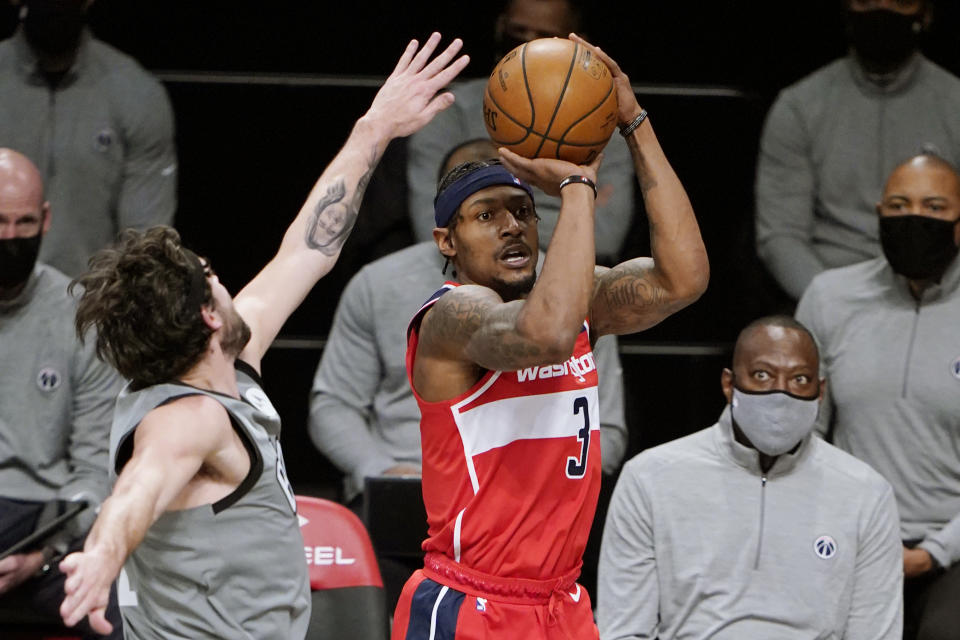 Brooklyn Nets guard Joe Harris, left, defends Washington Wizards guard Bradley Beal, right, during the first quarter of an NBA basketball game, Sunday, Jan. 3, 2021, in New York. (AP Photo/Kathy Willens)