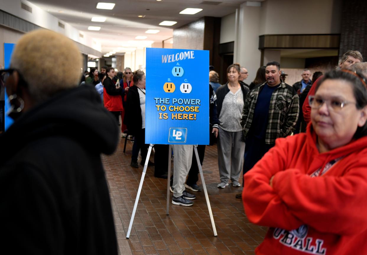 Energy companies speak to the public during an electric provider fair Jan. 5 at the Lubbock Memorial Civic Center.