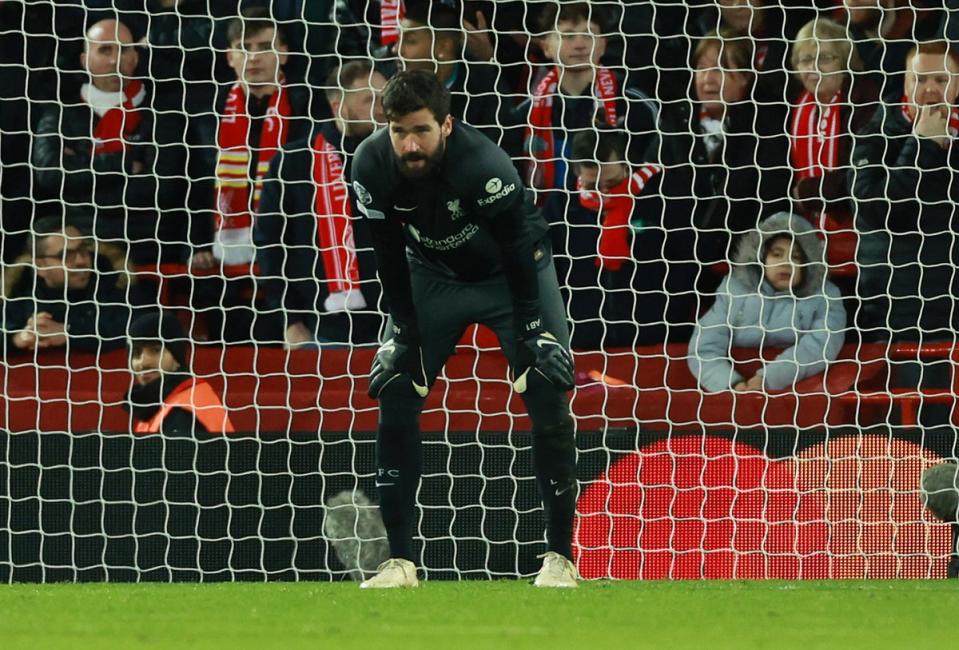 Alisson endured a torrid evening at Anfield  (REUTERS)