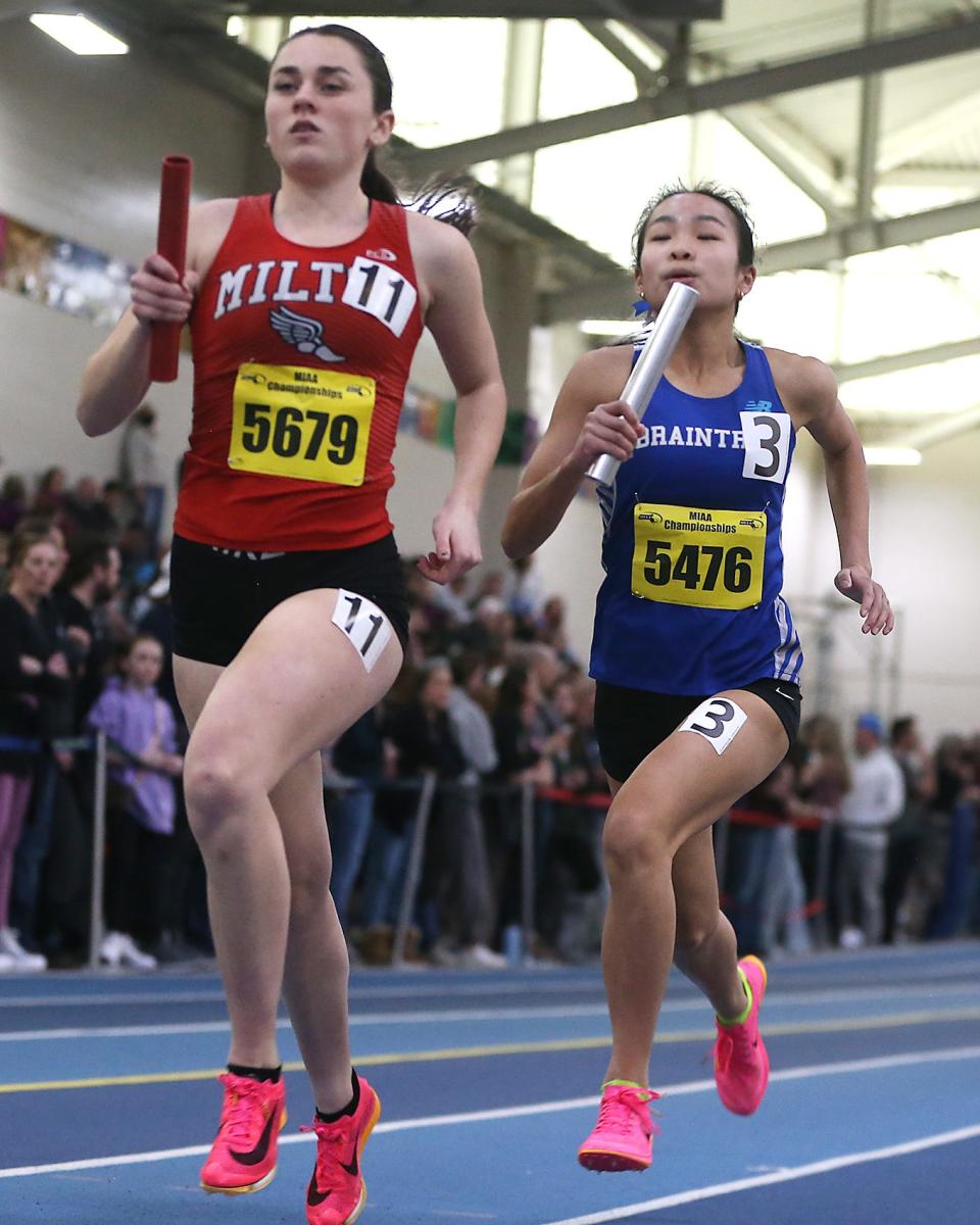 Braintree’s Caitlyn Chang looks to catch Milton’s Katie O’Toole during the 4X800 meter relay race where they placed 4th with a time of 9:44.73 at the MIAA Meet of Champions at the Reggie Lewis Track Center in Boston on Saturday, Feb. 25, 2023.