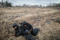 <p>Two migrants rest at the yard of an abandoned brick factory at the outskirts of Subotica, border town with Hungary in Serbia, Feb. 1, 2017. (Manu Brabo/MeMo) </p>