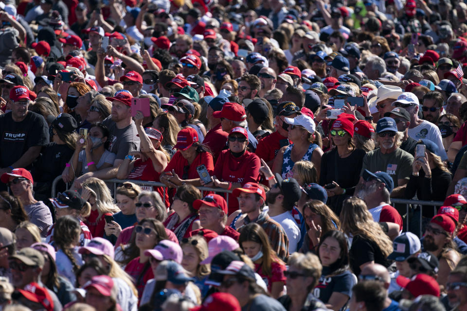 Supporters of President Donald Trump listen to him speak during a campaign rally at Laughlin/Bullhead International Airport, Wednesday, Oct. 28, 2020, in Bullhead City, Ariz. (AP Photo/Evan Vucci)