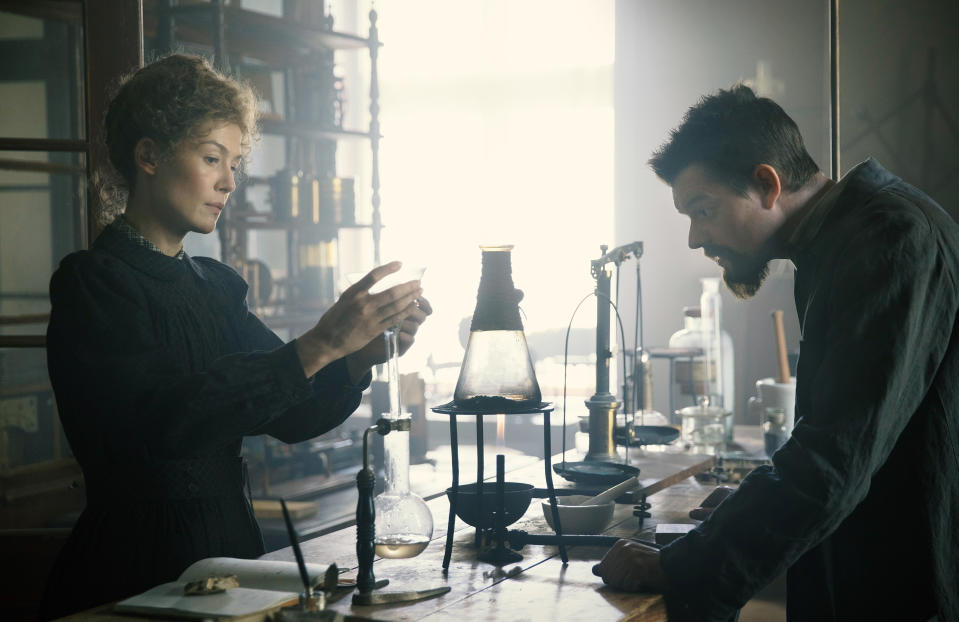 This image released by Amazon shows Rosamund Pike as Marie Curie, left, and Sam Riley as Pierre Curie in a scene from "Radioactive." (Amazon via AP)