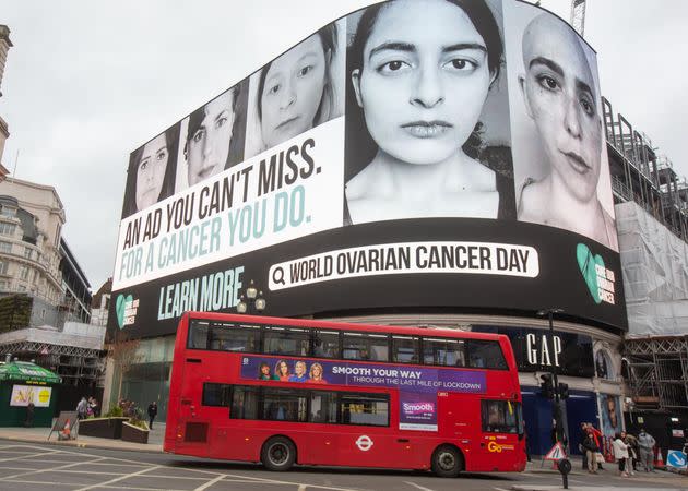 The author, second from left, featured on a billboard in London's Piccadilly Circus on World Ovarian Cancer Day 2021, beside others who share her low-grade serous ovarian cancer diagnosis. (Photo: Courtesy of Cure Our Ovarian Cancer)