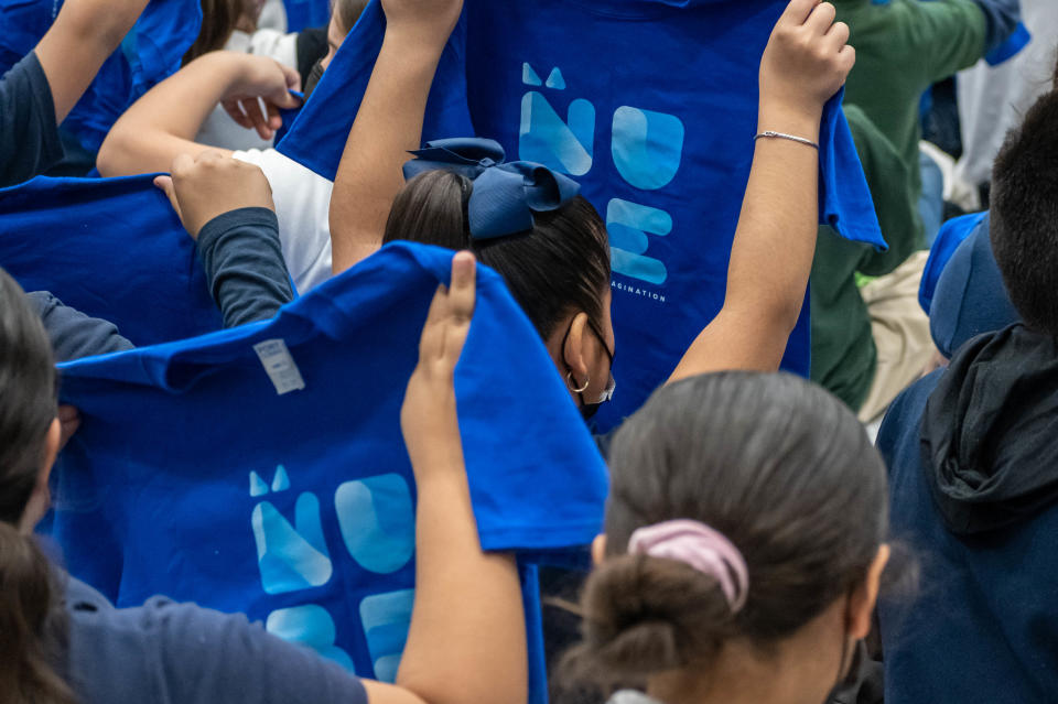 Aoy Elementary School students look at new shirts promoting La Nube, the upcoming El Paso Children's Museum, Wednesday, March 23.